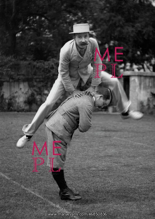  : Two men playing leapfrog