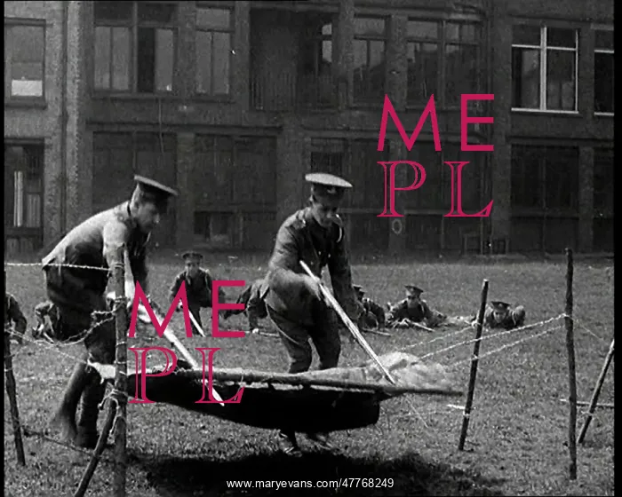 : Men Practising Crossing Barbed Wire. They Are : Men Practising Crossing Barbed Wire. They Are