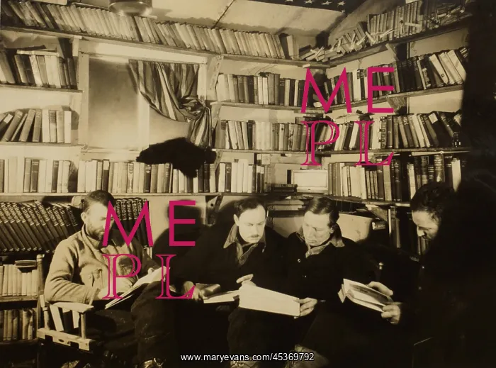 : Men reading in Byrds First Antarctic Expedition : Men reading in Byrds First Antarctic Expedition