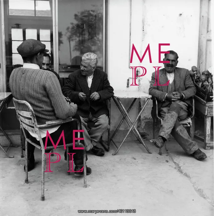 : Four men relaxing outside a cafe : Four men relaxing outside a cafe