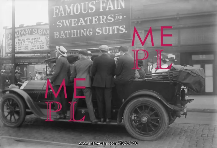 : Men ride on the running boards of a improvised ? : Men ride on the running boards of a improvised ?