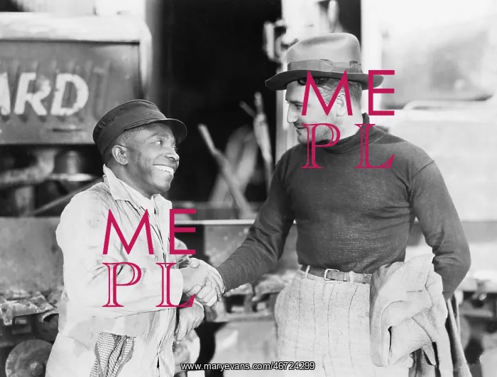 : Two men shaking hands with each other : Two men shaking hands with each other