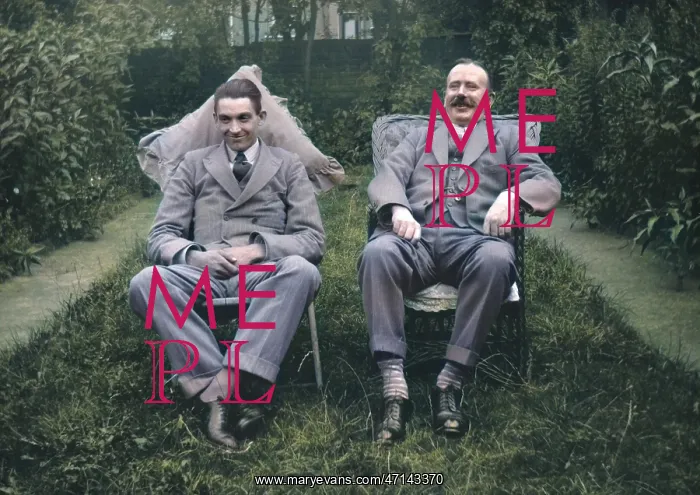 : Two men sitting in a garden : Two men sitting in a garden