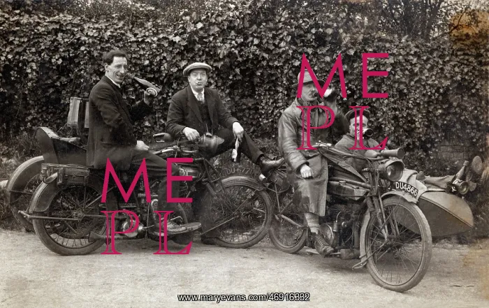 : Men sitting on their veteran motorcycles drinking beer : Men sitting on their veteran motorcycles drinking beer