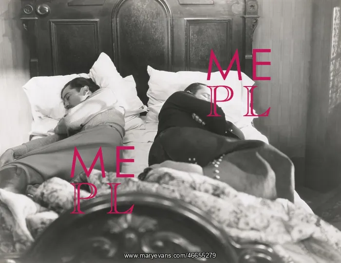  : Two men sleeping with their backs to each other