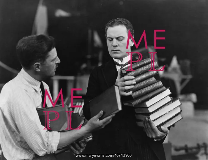 : Men with stacks of books : Men with stacks of books