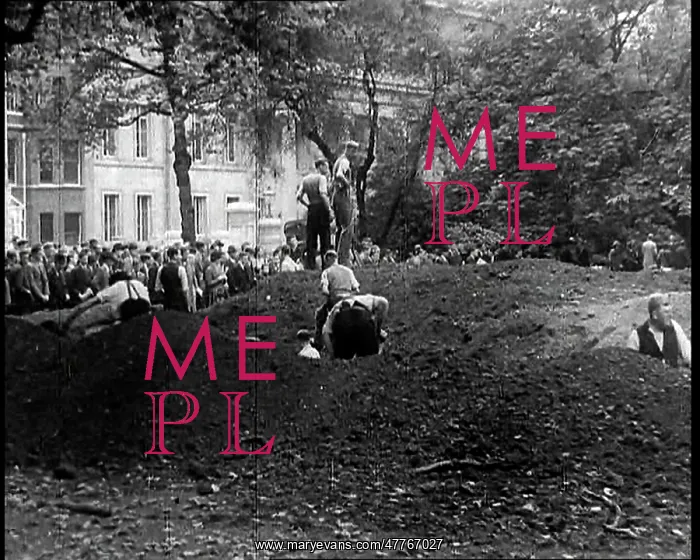 : Men Standing Behind Spoil Heaps In and By a : Men Standing Behind Spoil Heaps In and By a
