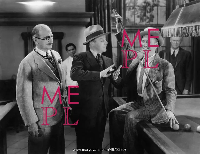 : Two men talking to each other and a man standing : Two men talking to each other and a man standing