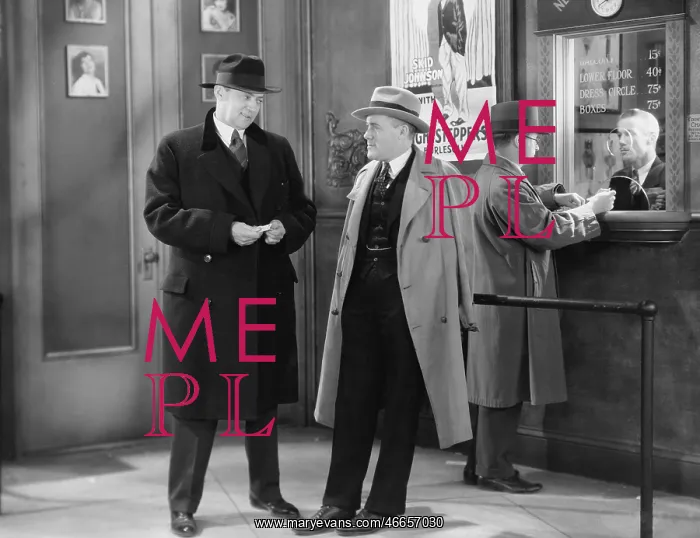 : Men talking in theater lobby : Men talking in theater lobby