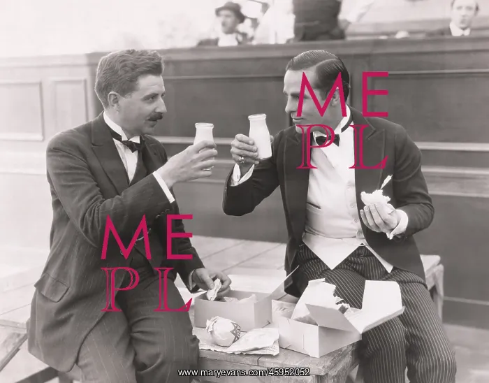  : Two men toasting with milk bottles