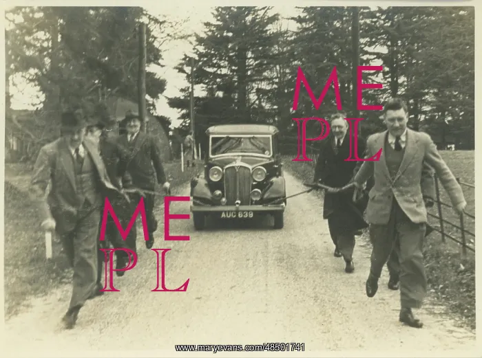  : Men Towing Vintage Rover Car