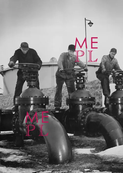 : Men turn the wheels of large valves that ? : Men turn the wheels of large valves that ?