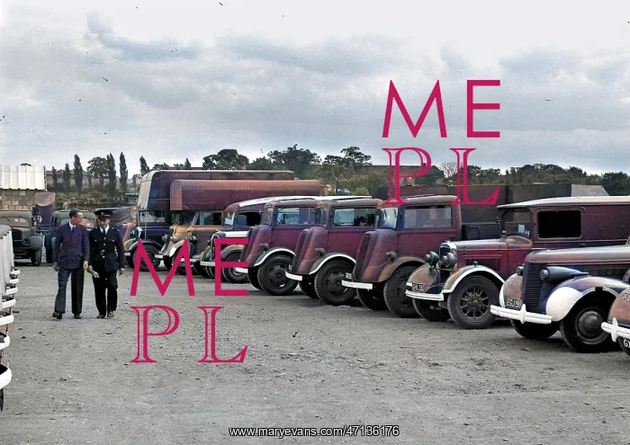 : Two men in a vehicle park : Two men in a vehicle park