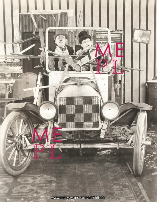 : Two men in a vintage car : Two men in a vintage car