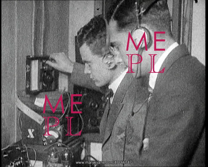 : Two Men Wearing Headphones and Calibrating : Two Men Wearing Headphones and Calibrating