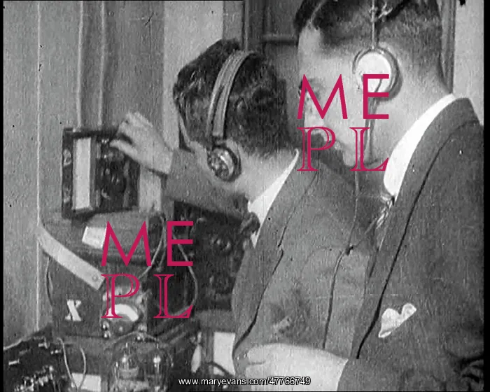 : Two Men Wearing Headphones and Calibrating : Two Men Wearing Headphones and Calibrating