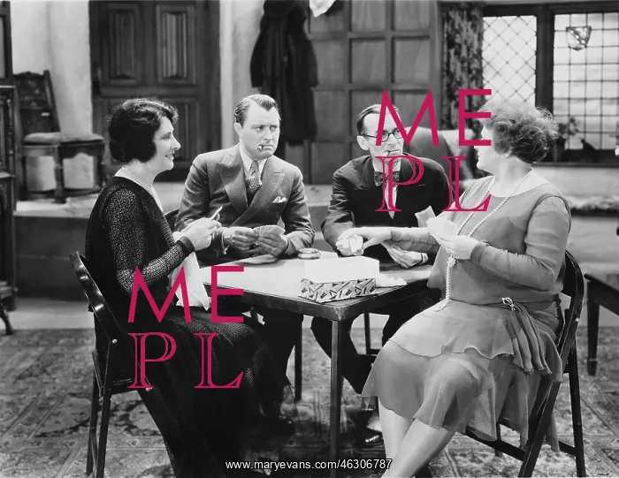 : Men and women playing a card game : Men and women playing a card game