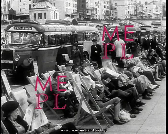 : Men and Women Sitting in Deckchairs on the : Men and Women Sitting in Deckchairs on the