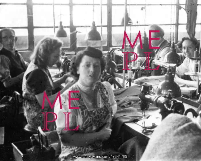 : Men and women in a tailors workshop : Men and women in a tailors workshop