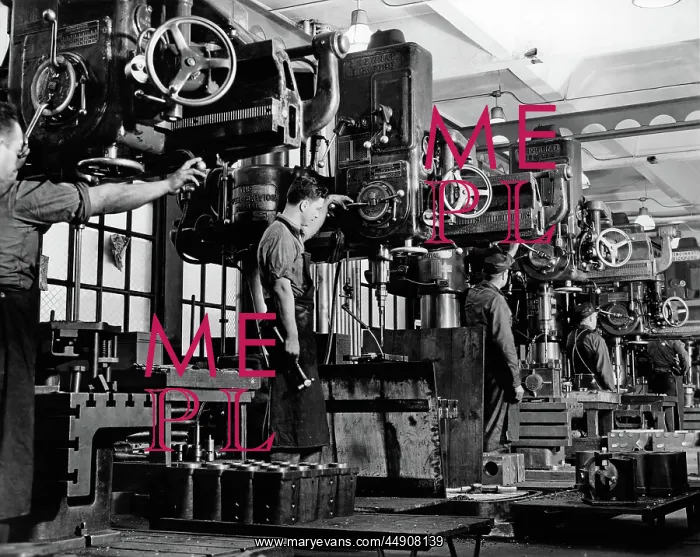 : Men working on milling machines indoor : Men working on milling machines indoor