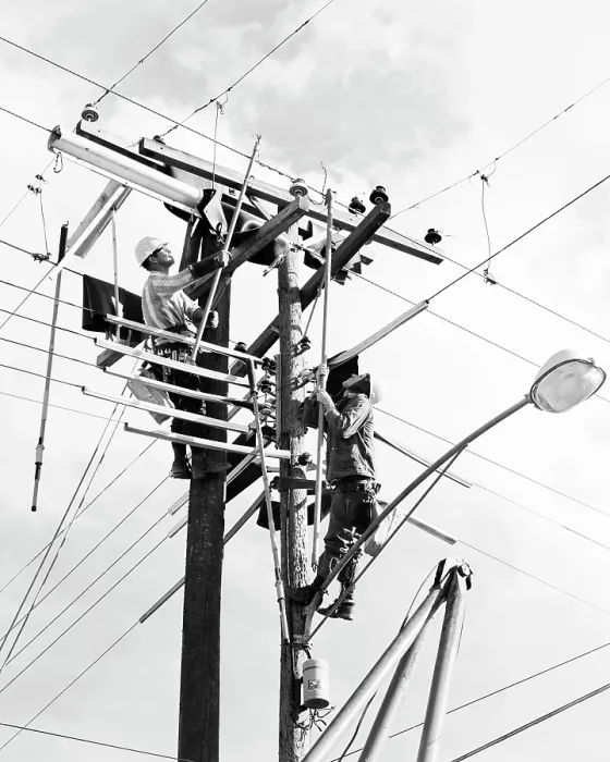 : Two Men Working on Public Utility Electrical Wires : Two Men Working on Public Utility Electrical Wires