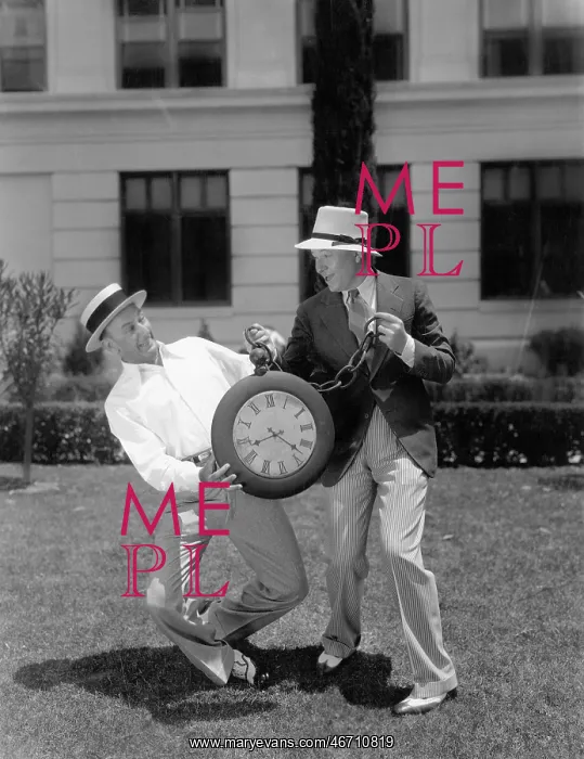 : Two men wrestling with an oversized pocket watch : Two men wrestling with an oversized pocket watch