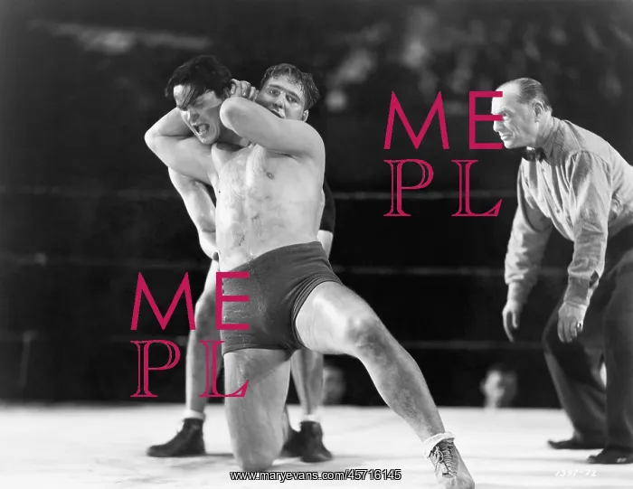 : Two men wrestling with referee making a call in : Two men wrestling with referee making a call in