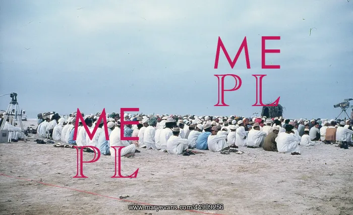 : Men and young boys sitting on the beach in Oman : Men and young boys sitting on the beach in Oman