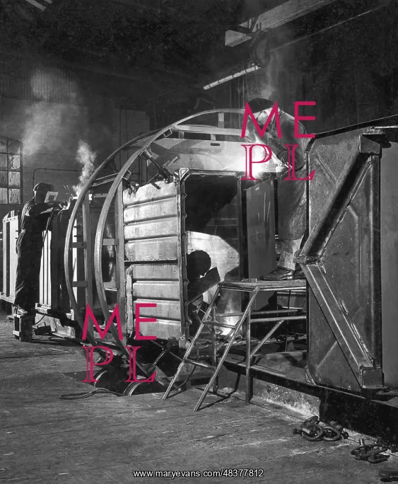 : Metalworkers welding a railway carriage : Metalworkers welding a railway carriage