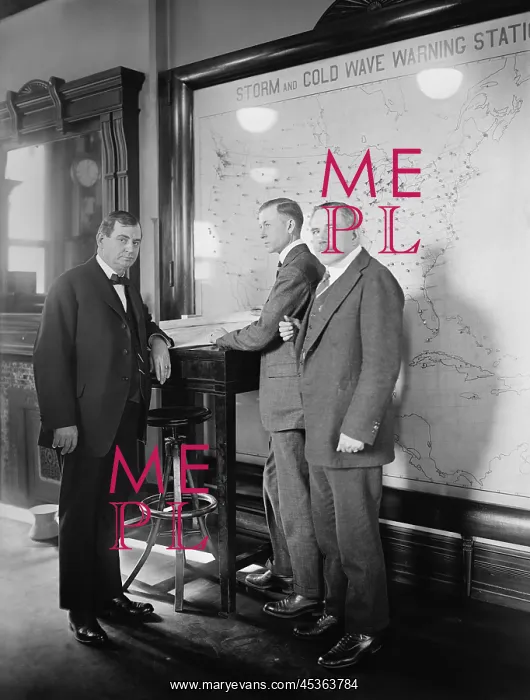 : Meteorologists at the U.S. Weather Bureau stand : Meteorologists at the U.S. Weather Bureau stand