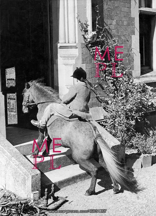 : Michael Carleton Smith on a Pony on the way in a house : Michael Carleton Smith on a Pony on the way in a house