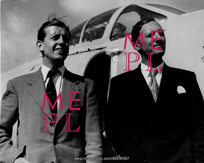 : Michael Lithgow at the airport with another man : Michael Lithgow at the airport with another man