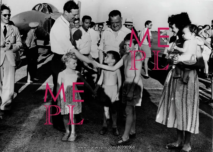 : Michael Lithgow shaking hands with children : Michael Lithgow shaking hands with children