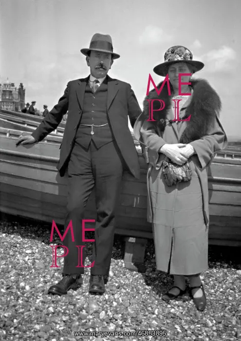 : Middle-aged couple on a pebbly beach : Middle-aged couple on a pebbly beach