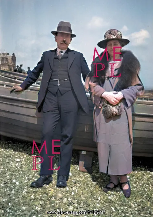 : Middle-aged couple on a pebbly beach : Middle-aged couple on a pebbly beach