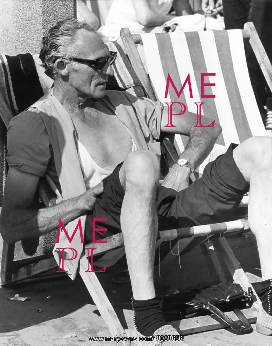 : Middle-aged man in a deckchair at the seaside : Middle-aged man in a deckchair at the seaside