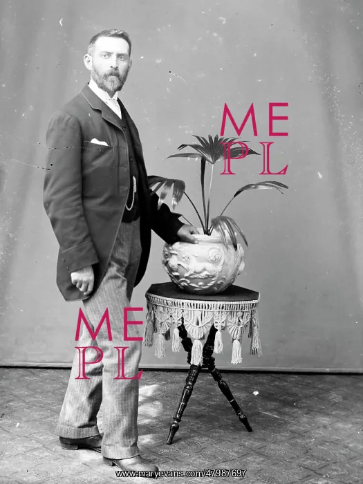 : Middle aged man with potted palm, Mid Wales : Middle aged man with potted palm, Mid Wales