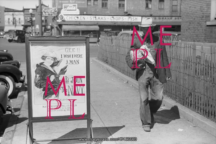 : Migrant fruit worker from Arkansas walking by the post offic : Migrant fruit worker from Arkansas walking by the post offic