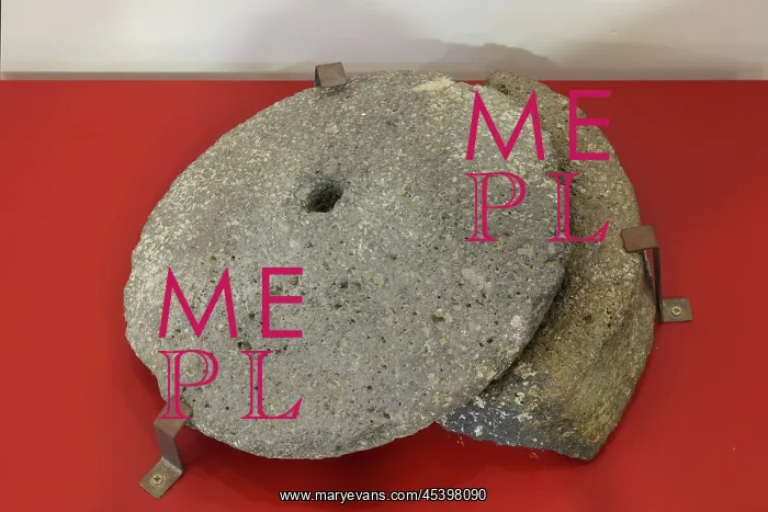 : Millstone, Musee d'Ambrussum, Ambrussum, Occitanie, France : Millstone, Musee d'Ambrussum, Ambrussum, Occitanie, France