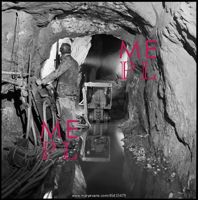 : A miner operating a piece of machinery in Ladywash Mine : A miner operating a piece of machinery in Ladywash Mine