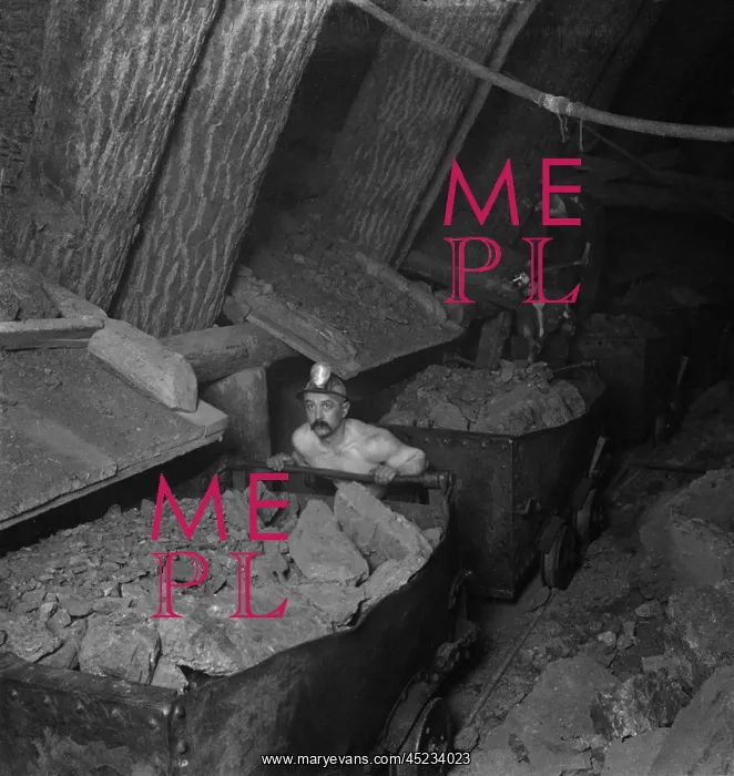 : A miner working a mine underground, loading ? : A miner working a mine underground, loading ?