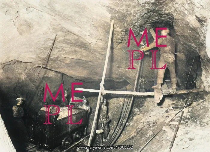  : Miners loading a mine car in a coal mine in America