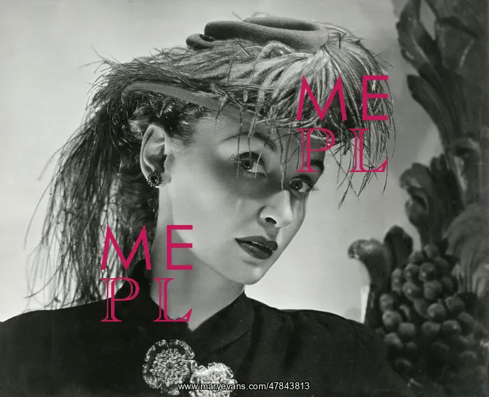 : Model in jaunty small hat with elaborate feathers : Model in jaunty small hat with elaborate feathers