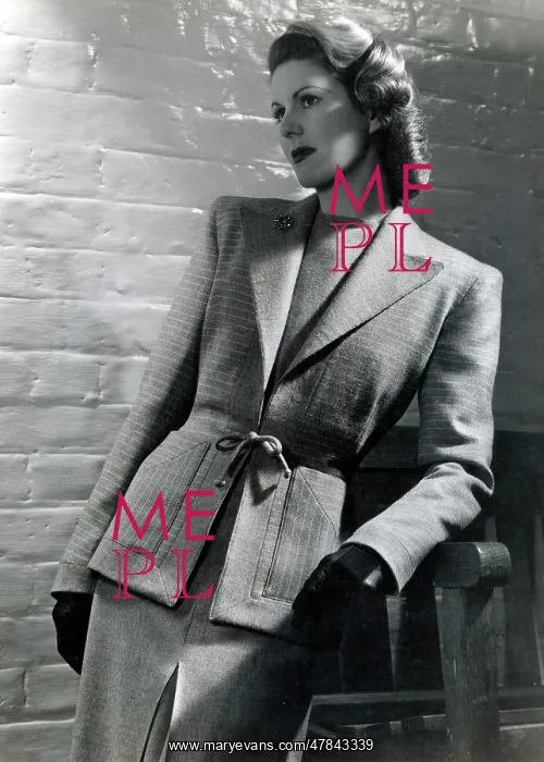 : Model leaning against a bench, smart two-piece wool suit : Model leaning against a bench, smart two-piece wool suit