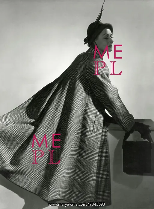 : Model in a long woollen cape coat : Model in a long woollen cape coat