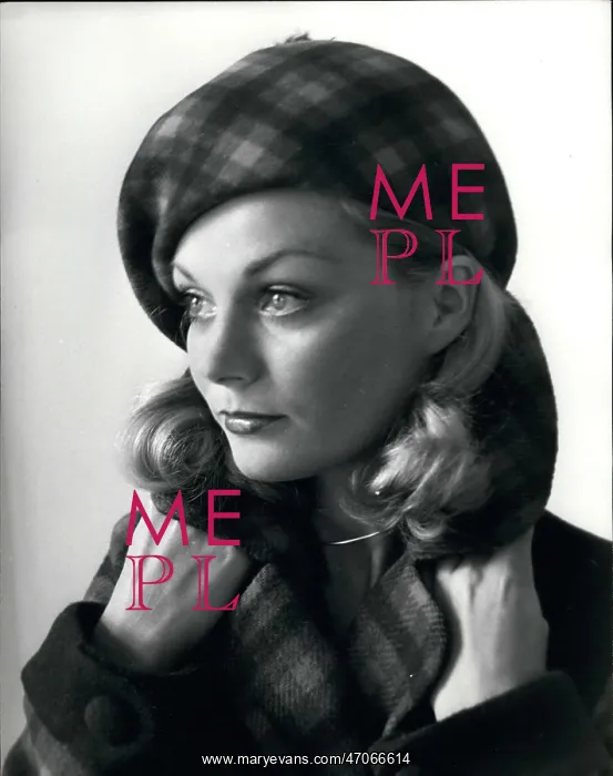 : Model in Scottish plaid beret designed by Carven : Model in Scottish plaid beret designed by Carven