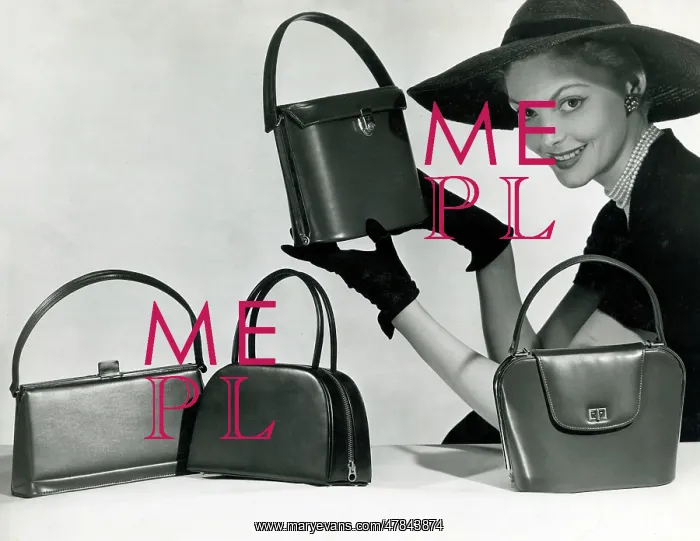 : A model showcasing four elegant leather handbags : A model showcasing four elegant leather handbags