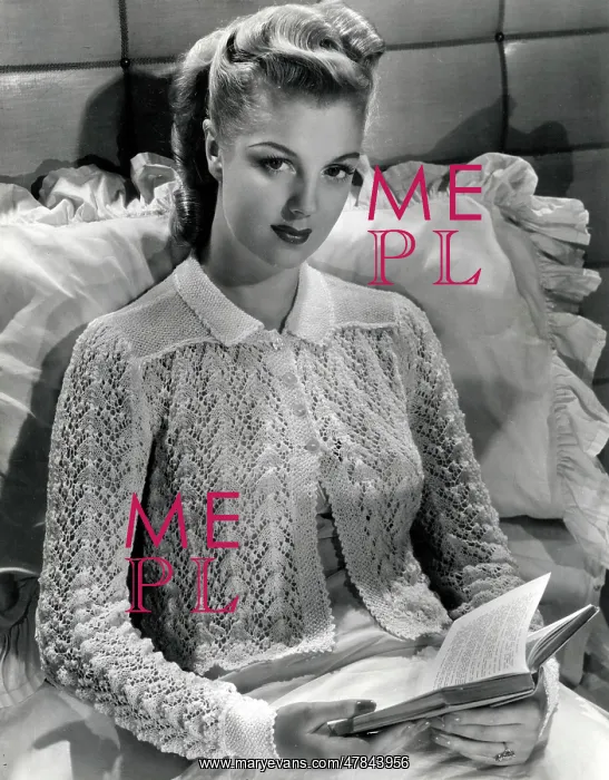 : Model sitting in bed on a large silk pillow, reading a novel : Model sitting in bed on a large silk pillow, reading a novel