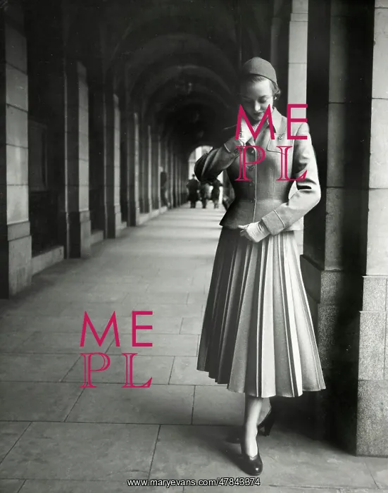 : Model standing at end of a covered walkway - two-piece suit : Model standing at end of a covered walkway - two-piece suit