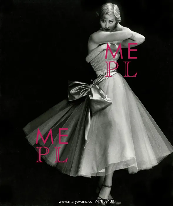 : Model in strapless full-skirted dress with bow : Model in strapless full-skirted dress with bow